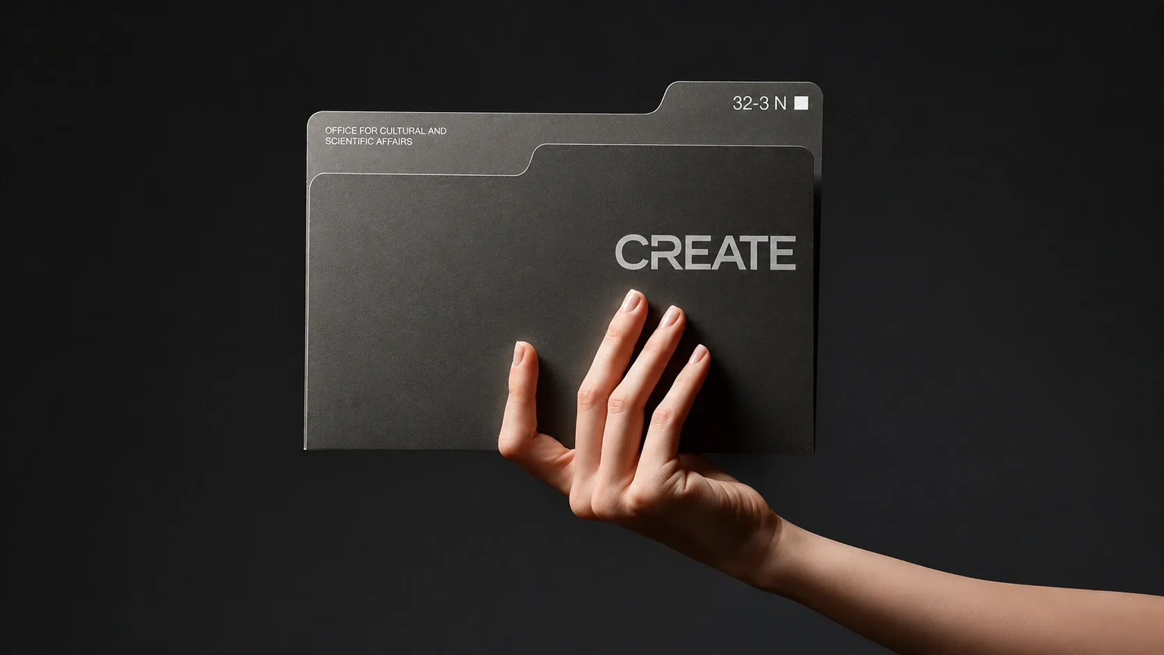 Hand reaching for a folder labeled Create